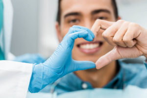 Patient doing heart shapes with hands
