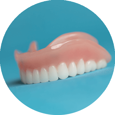 traditional dentures on table at dentist