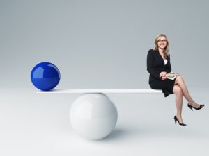 Woman in business attire on balance