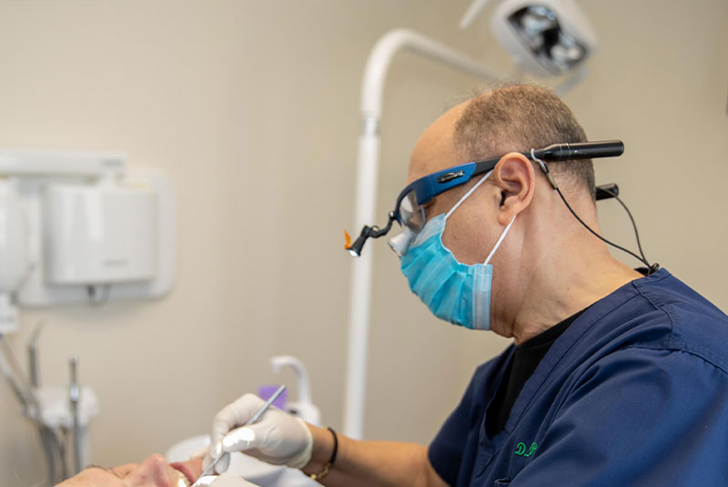 Doctor performing dental procedure on patient