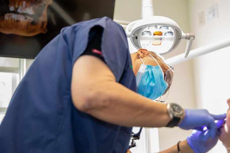 patient performing dental procedure within the dental practice