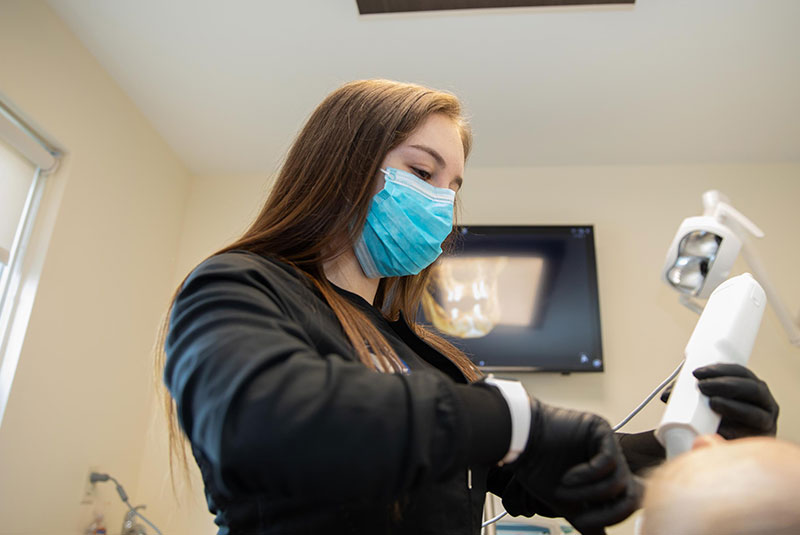 staff member going through with dental procedure with patient